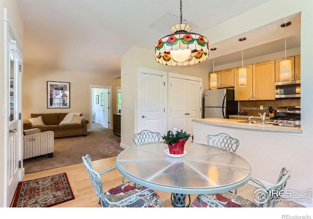 193 2nd Ave Unit A, Lyons, CO 80540 - dining area with light wood finished floors