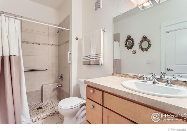 193 2nd Ave Unit A, Lyons, CO 80540 - bathroom featuring vanity, a tile shower, and tile patterned flooring