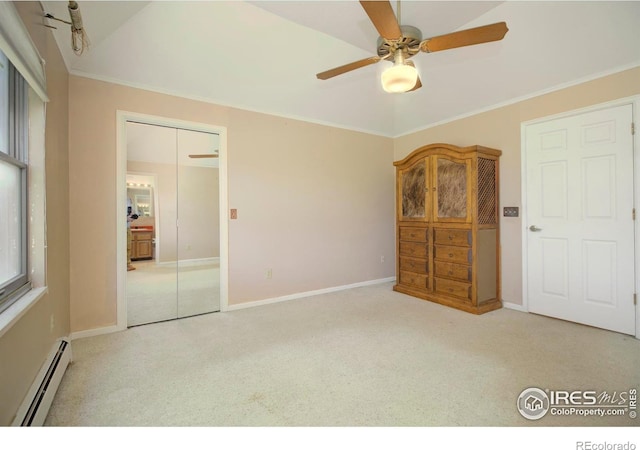 7035 S Boulder Rd, Boulder, CO 80303 - unfurnished bedroom with baseboard heating, carpet, crown molding, a ceiling fan, and a closet
