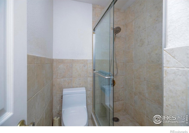 7035 S Boulder Rd, Boulder, CO 80303 - bathroom featuring a shower stall and tile walls