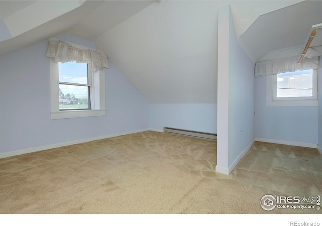 7035 S Boulder Rd, Boulder, CO 80303 - additional living space featuring a baseboard heating unit, carpet flooring, and lofted ceiling