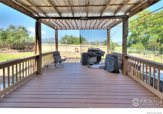 7035 S Boulder Rd, Boulder, CO 80303 - wooden deck with grilling area and a fenced backyard