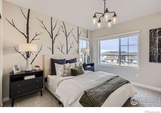 921 Abbott Ln, Fort Collins, CO 80524 - carpeted bedroom featuring baseboards and a chandelier