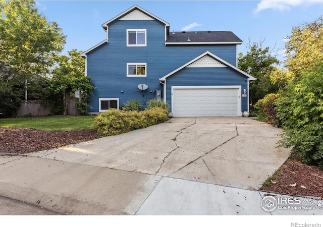 1993 S Fork Dr, Lafayette, CO 80026 - view of property exterior with driveway and a garage