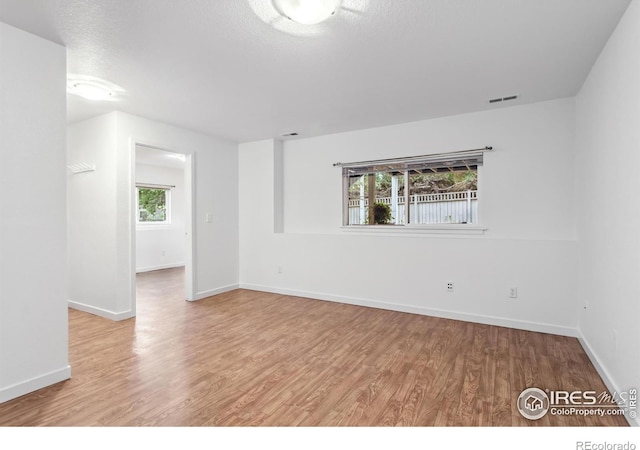 1993 S Fork Dr, Lafayette, CO 80026 - empty room featuring wood finished floors and a textured ceiling