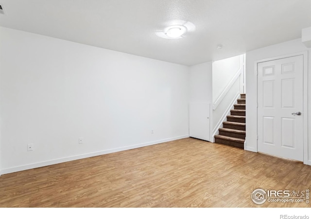 1993 S Fork Dr, Lafayette, CO 80026 - spare room with light wood finished floors and stairway