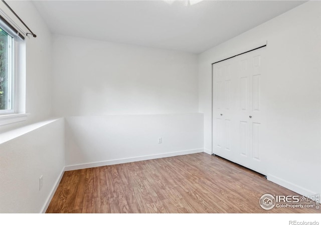 1993 S Fork Dr, Lafayette, CO 80026 - unfurnished bedroom with wood finished floors and a closet