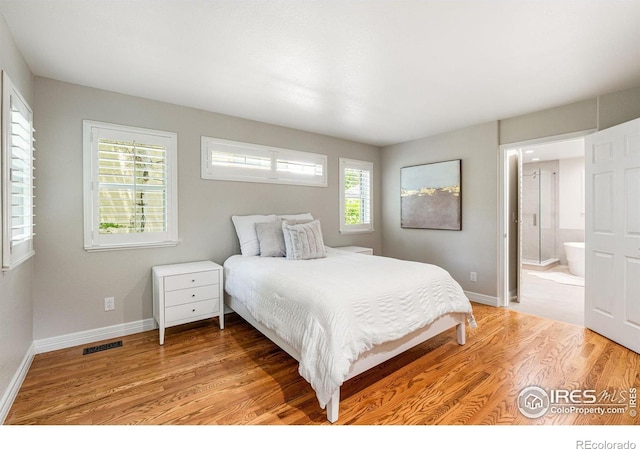 388 Fairfield Ln, Louisville, CO 80027 - bedroom featuring light wood-style floors and connected bathroom