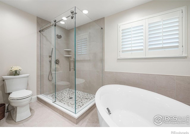 388 Fairfield Ln, Louisville, CO 80027 - bathroom with a soaking tub, a shower stall, tile patterned floors, and recessed lighting