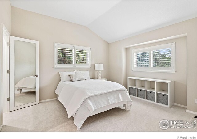 388 Fairfield Ln, Louisville, CO 80027 - bedroom with multiple windows, carpet flooring, and vaulted ceiling