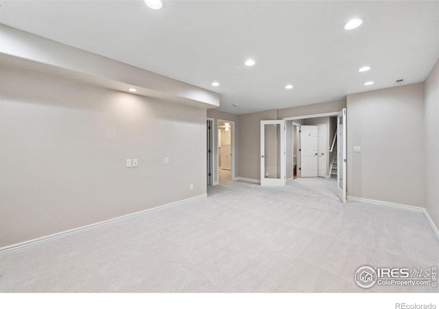 388 Fairfield Ln, Louisville, CO 80027 - basement featuring recessed lighting, light colored carpet, and stairs