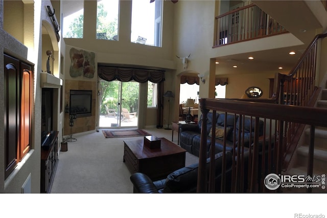 1402 Westfield Dr, Fort Collins, CO 80526 - carpeted living area featuring a high ceiling and baseboards