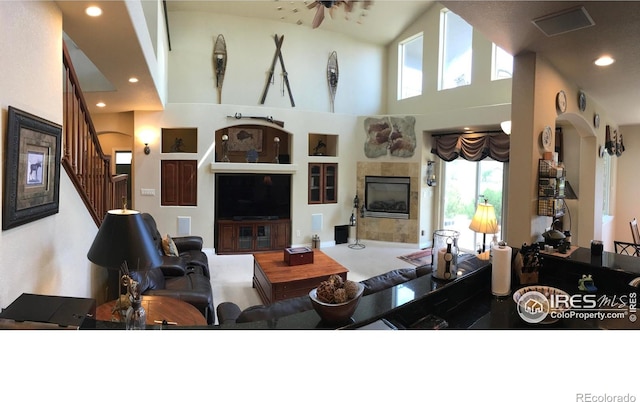 1402 Westfield Dr, Fort Collins, CO 80526 - living room featuring plenty of natural light, stairway, recessed lighting, a high ceiling, and built in features