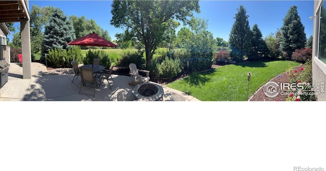1402 Westfield Dr, Fort Collins, CO 80526 - view of grassy yard featuring a patio area and outdoor dining space