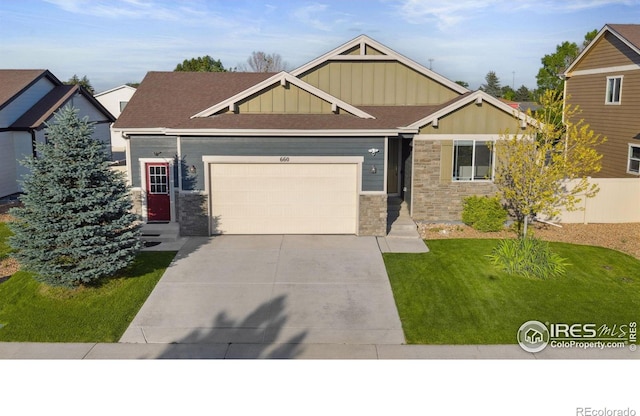 660 Cimarron Trl, Ault, CO 80610 - craftsman house with board and batten siding, stone siding, an attached garage, driveway, and a front yard