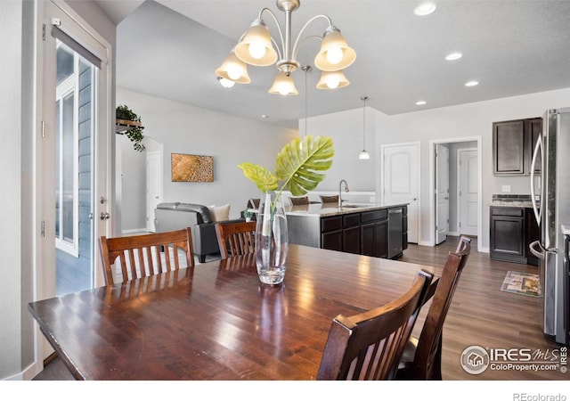 660 Cimarron Trl, Ault, CO 80610 - dining space with a chandelier, dark wood-type flooring, and recessed lighting