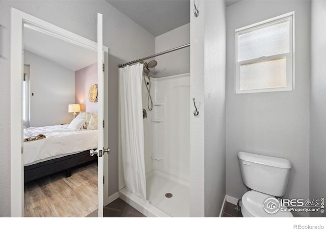 660 Cimarron Trl, Ault, CO 80610 - ensuite bathroom with a shower stall and wood finished floors