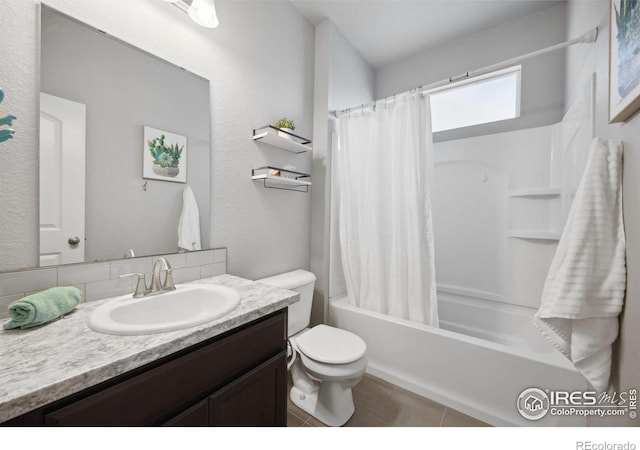 660 Cimarron Trl, Ault, CO 80610 - bathroom featuring vanity, shower / bath combo with shower curtain, tasteful backsplash, and tile patterned flooring