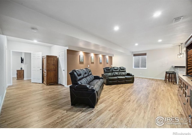 660 Cimarron Trl, Ault, CO 80610 - living room with light wood finished floors and recessed lighting