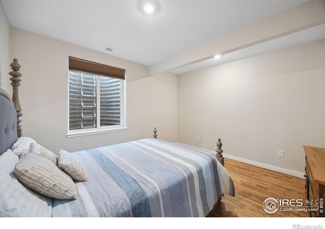 660 Cimarron Trl, Ault, CO 80610 - bedroom with wood finished floors and recessed lighting
