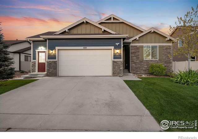 660 Cimarron Trl, Ault, CO 80610 - craftsman-style home with stone siding, an attached garage, board and batten siding, and driveway