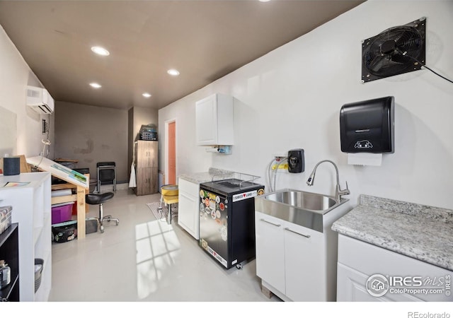 660 Cimarron Trl, Ault, CO 80610 - kitchen with recessed lighting, a wall mounted AC, white cabinetry, and dishwasher