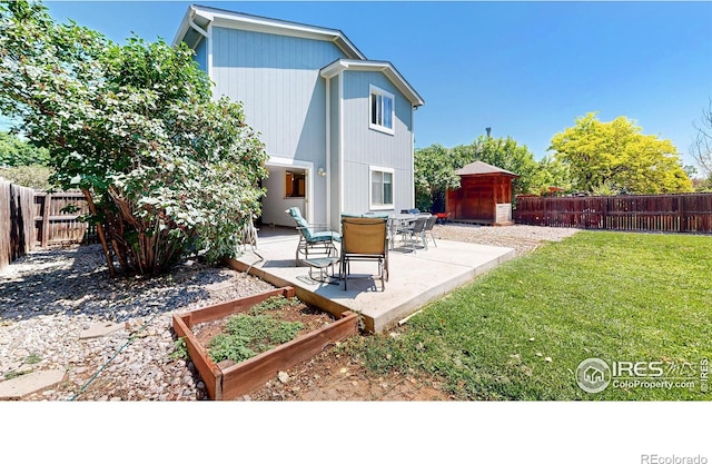 2027 Churchill Ct, Fort Collins, CO 80526 - back of house featuring a patio, a storage unit, a fenced backyard, and a garden