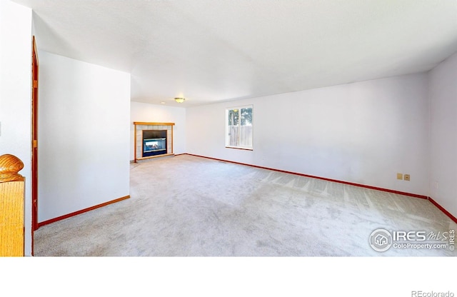 2027 Churchill Ct, Fort Collins, CO 80526 - unfurnished living room featuring carpet flooring and a tile fireplace