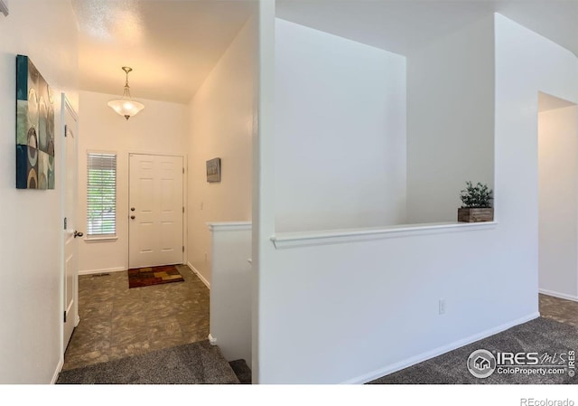 2244 Woodbury Ln, Fort Collins, CO 80524 - carpeted entrance foyer with baseboards and lofted ceiling