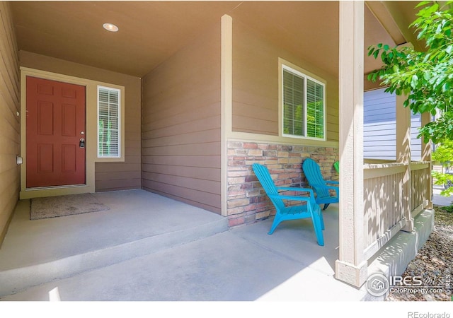 2244 Woodbury Ln, Fort Collins, CO 80524 - property entrance featuring stone siding