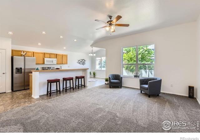 2244 Woodbury Ln, Fort Collins, CO 80524 - living room featuring a ceiling fan, recessed lighting, and a chandelier