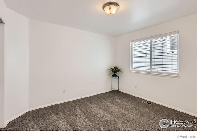 2244 Woodbury Ln, Fort Collins, CO 80524 - empty room with dark colored carpet