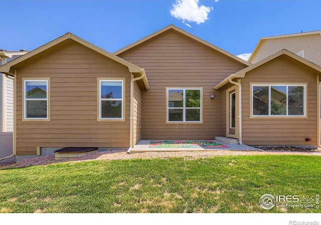 2244 Woodbury Ln, Fort Collins, CO 80524 - rear view of property with a yard