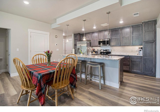 285 High Point Dr Unit H-104, Longmont, CO 80504 - dining area featuring light wood-style flooring and recessed lighting