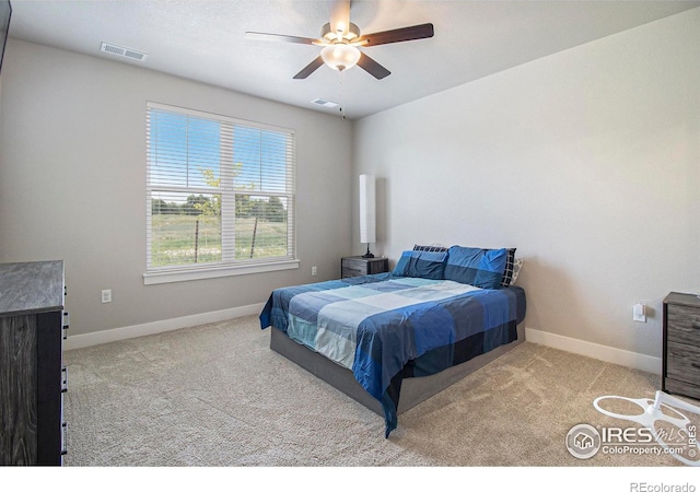 285 High Point Dr Unit H-104, Longmont, CO 80504 - carpeted bedroom featuring baseboards and ceiling fan