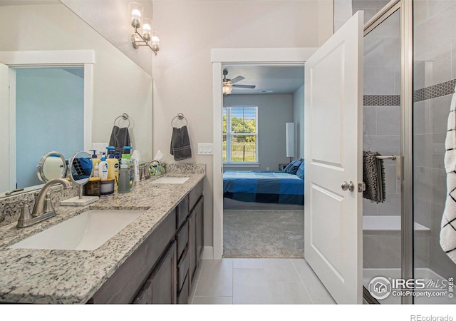 285 High Point Dr Unit H-104, Longmont, CO 80504 - full bath with ensuite bath, double vanity, a stall shower, ceiling fan, and tile patterned floors