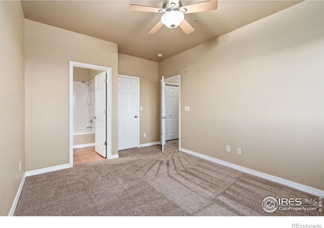 6925 19th St Unit 15, Greeley, CO 80634 - unfurnished bedroom featuring carpet flooring, connected bathroom, and ceiling fan