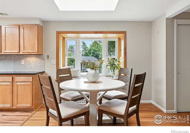 775 Pleasant St, Boulder, CO 80302 - dining space with a skylight and light wood finished floors