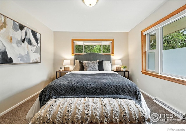 775 Pleasant St, Boulder, CO 80302 - carpeted bedroom featuring baseboard heating and multiple windows