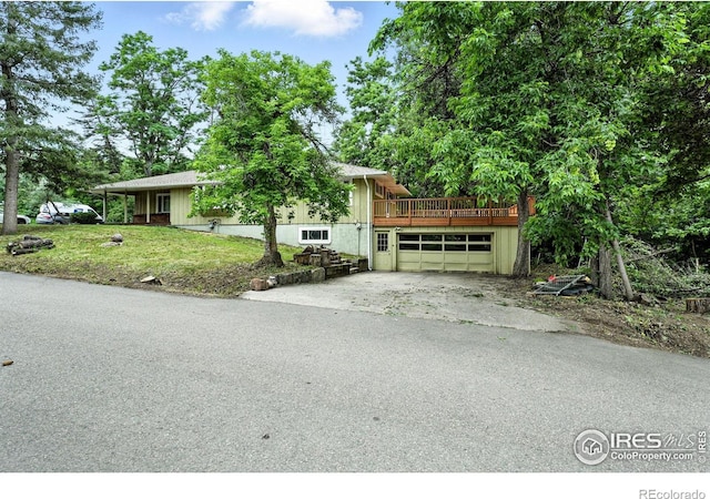 775 Pleasant St, Boulder, CO 80302 - view of front facade with asphalt driveway, a garage, a deck, and a front lawn