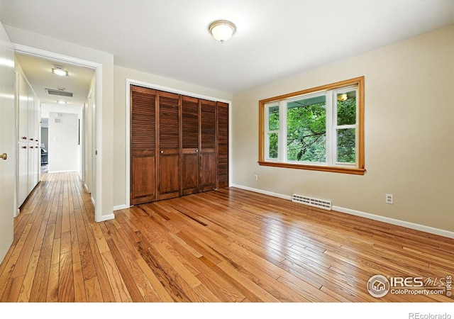 775 Pleasant St, Boulder, CO 80302 - unfurnished bedroom featuring light wood-type flooring and a closet