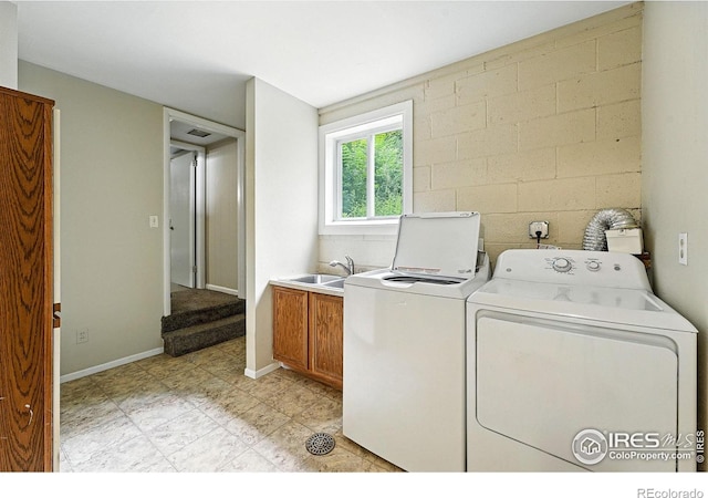775 Pleasant St, Boulder, CO 80302 - laundry area featuring cabinet space, washer and dryer, and concrete block wall