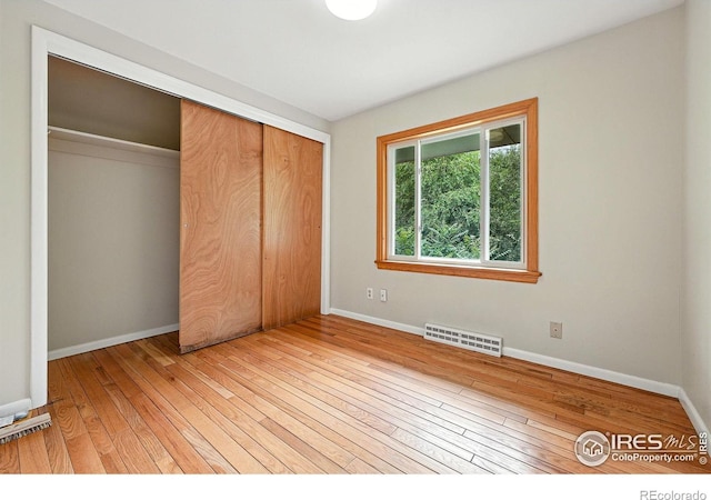 775 Pleasant St, Boulder, CO 80302 - unfurnished bedroom featuring light wood-type flooring and a closet