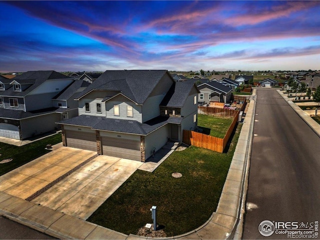 501 Foxtail Pl, Wiggins, CO 80654 - view of front facade with a residential view, a garage, and concrete driveway