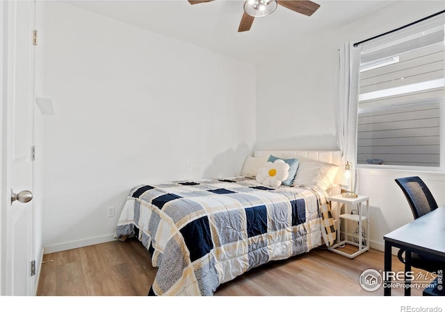 9873 Ceylon St, Commerce City, CO 80022 - bedroom featuring wood finished floors and a ceiling fan
