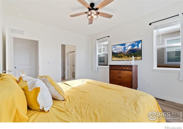 9873 Ceylon St, Commerce City, CO 80022 - bedroom with wood finished floors and a ceiling fan