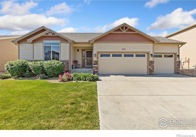 1613 Alpine Ave, Berthoud, CO 80513 - view of front of property with an attached garage, a front lawn, concrete driveway, and stone siding