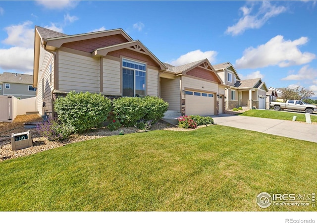 1613 Alpine Ave, Berthoud, CO 80513 - view of front facade featuring a garage, concrete driveway, a front lawn, and stone siding