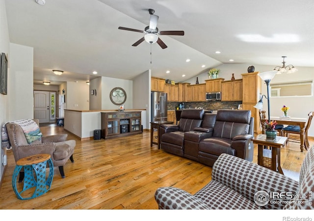 1613 Alpine Ave, Berthoud, CO 80513 - living area featuring light wood finished floors, vaulted ceiling, a ceiling fan, a chandelier, and recessed lighting