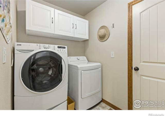 1613 Alpine Ave, Berthoud, CO 80513 - washroom with cabinet space and washing machine and dryer